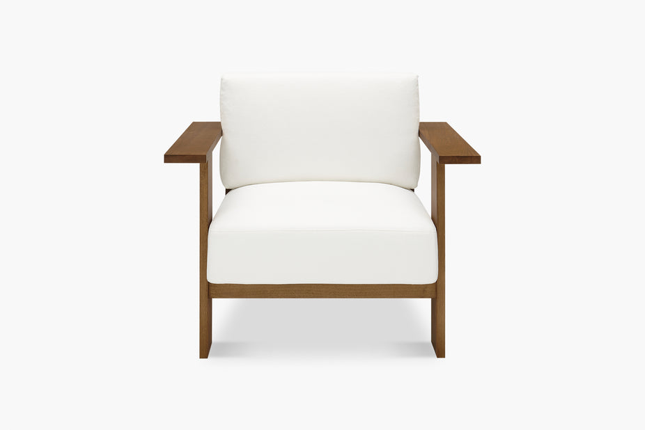 white armchair with brown timber frame