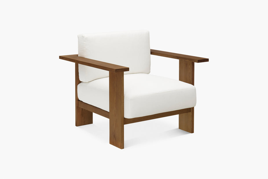 white armchair with brown frame